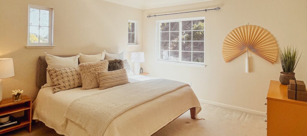 Beautifully staged bedroom in a San Rafael home by Interior Solutions Staging, showcasing the benefits of occupied staging in the Bay Area.