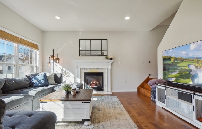 Warm and welcoming living room with fireplace staged by CHC Home Staging Inc – example of occupied home staging in New Jersey.