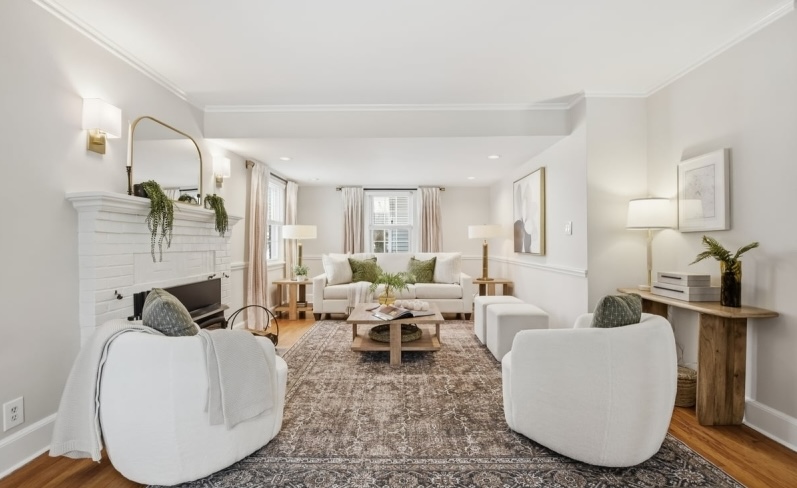 Professionally staged living room in Madison Boro, New Jersey featuring neutral furnishings, layered textures, and a warm modern design style created to help buyers emotionally connect with the home