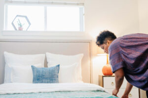 Woman staging a bedroom - Ask The Experts, Advice on Itemized Quotes for Clients