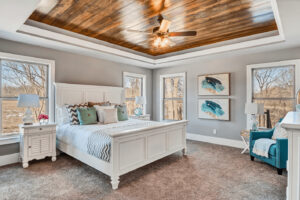 Vacation rental bedroom designed by Pink Pineapple Properties, Courtney Schomburg - advice on investing in short-term rentals