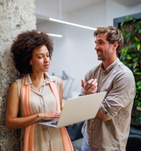 woman reading over updates to their home staging contract with male business partner