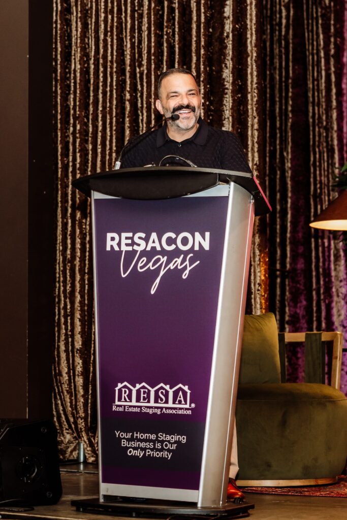 Jason Saft of Staged to Sell Home accepting a 2025 Home Staging Industry Award on stage at RESACON Vegas, hosted by the Real Estate Staging Association®.